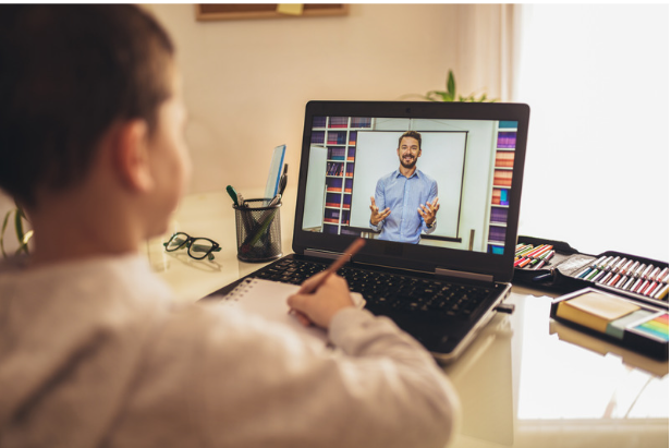 student watching a teacher on laptop